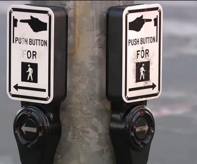 Watch: Crosswalk buttons hacked to play hoax Musk, Zuckerberg recordings